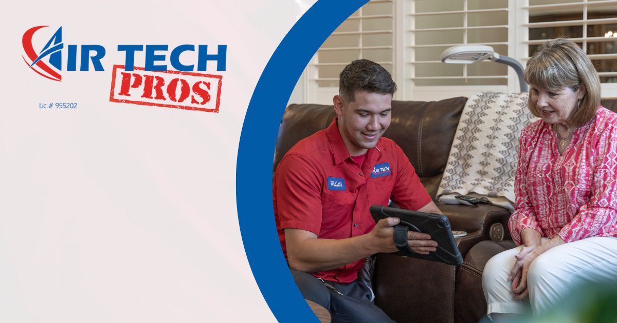 Image of a technician helping a customer with their HVAC